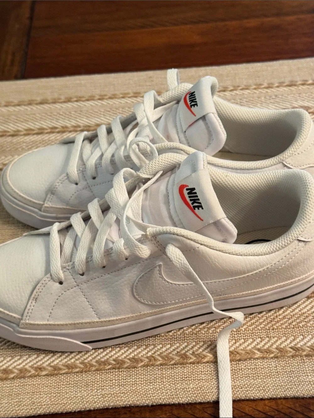 Nike White Low-Top Sneakers with Red Tongue Logo